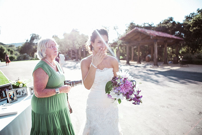 bride gets emotional when seeing her grandparents at her Holman Ranch wedding in carmel california by heather elizabeth photography