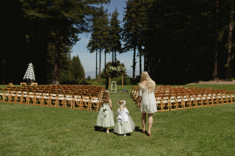 flower girls watching a wedding being prepared at the mountain terrace in woodside california by heather elizabeth photography