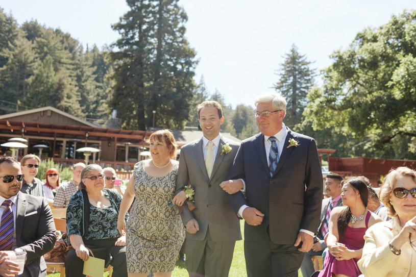 Groom walking down the aisle with both of his parents at a gay wedding in Woodside California by Heather Elizabeth Photography