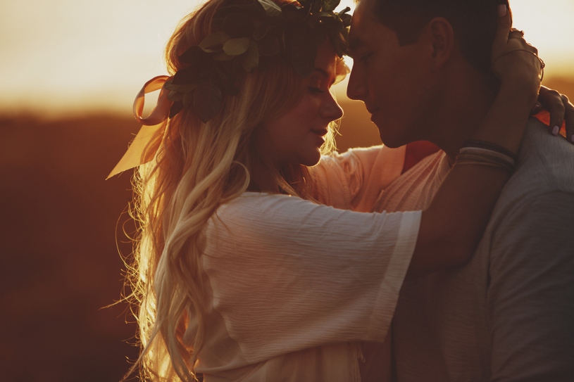 romantic sunset engagement session with a flower crown in big sur for a boho bride by heather elizabeth photography