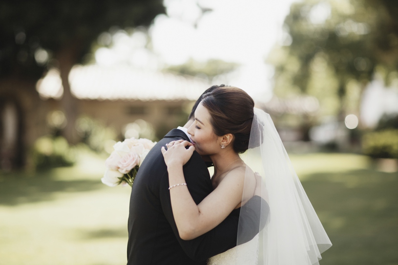 sweet moment during a first look at a wedding at the adobo lodge in santa clara by Heather Elizabeth Photography