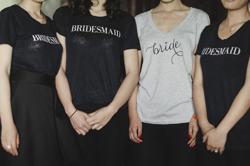 chic bridesmaids shirts at a wedding at the adobo lodge by heather elizabeth photography