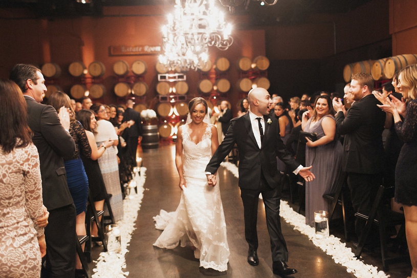 wedding ceremony at the palm event center by heather elizabeth photography