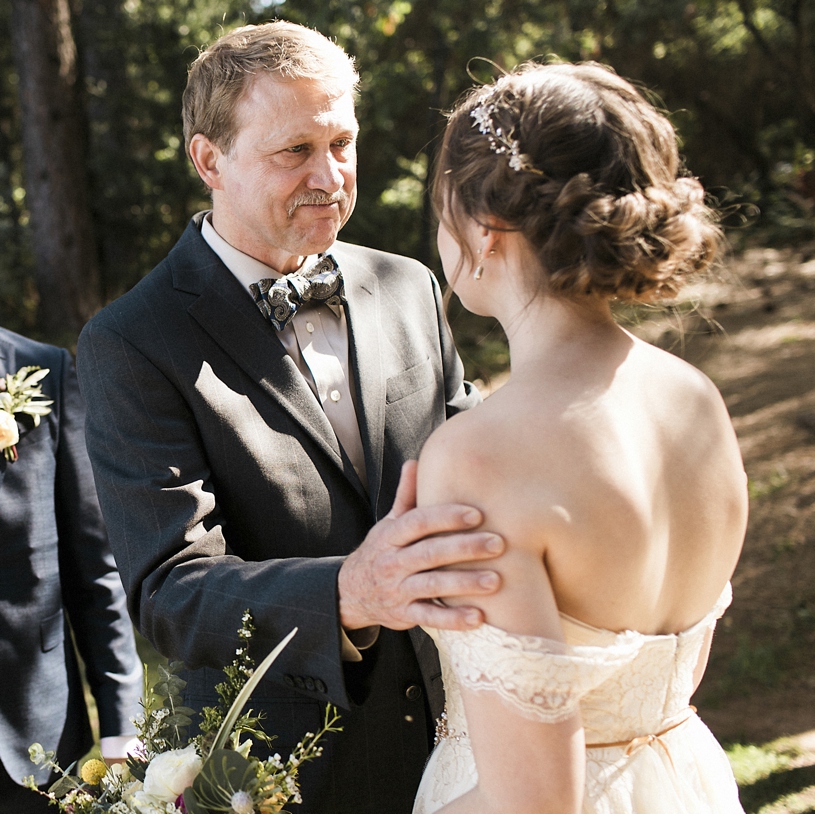 Emotional wedding photography of father giving his daughter away at a ceremony at the Forest House Lodge by Heather elizabeth Photography