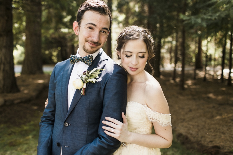 bride wearing twigs and honey bohemian headband and a sarah silver dress at the forest house lodge in foresthill by heather elizabeth photography