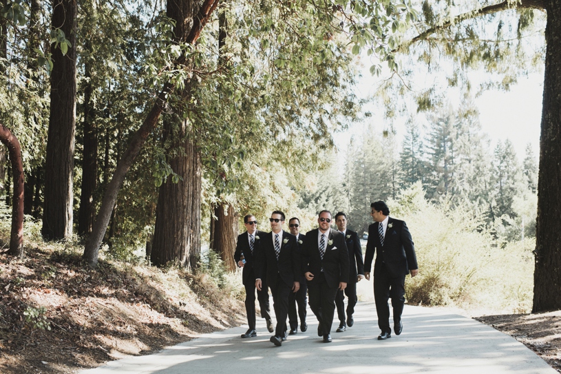Groomsmen walking to a wedding at Pema Osel Ling by Heather Elizabeth Photography