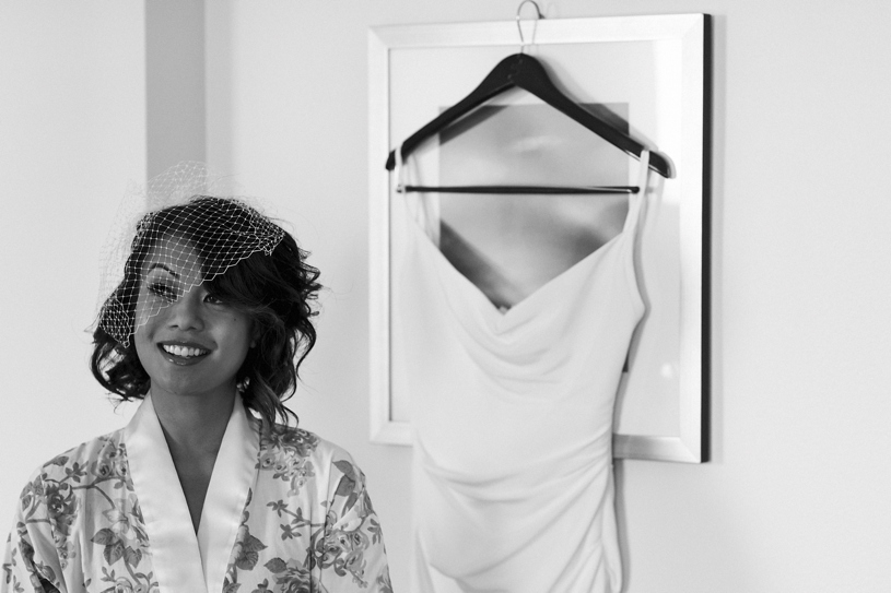 a bride and her slinky sexy wedding dress at the Fairmont in San Francisco by Heather Elizabeth Photography